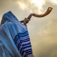 man blowing shofar