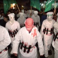 Palestinians in suicide bomber outfits in 2002