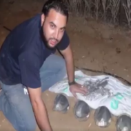 Hamas terrorist burying rockets