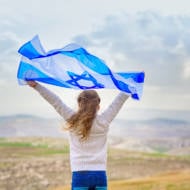 Little,Patriot,Jewish,Girl,Standing,And,Enjoying,With,The,Flag