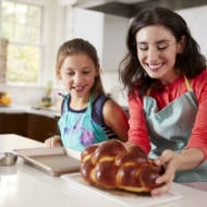 Jewish mother and daughter back challah