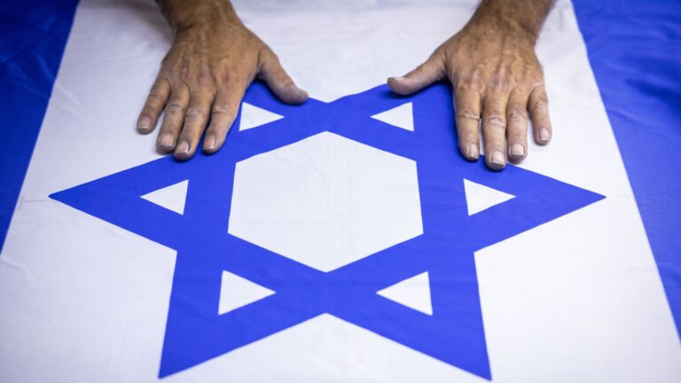 A freshly made flag at Berman’s Flag and Embroidery factory in Jerusalem. Photo by Yonatan Sindel/Flash90