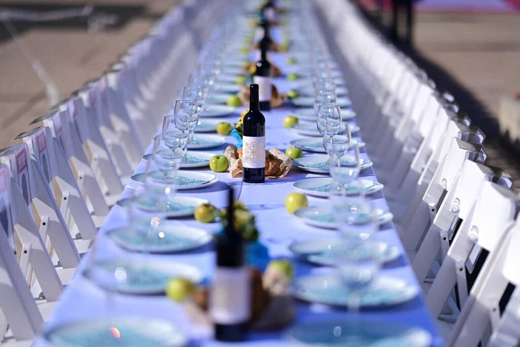 Families of Israelis held hostage by Hamas in the Gaza Strip set a symbolic Shabbat table with more than 200 empty seats for the hostages outside the Tel Aviv Museum of Art on Oct. 20, 2023. Photo by Tomer Neuberg/Flash90.
