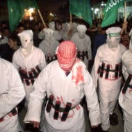 Palestinians in suicide bomber outfits in 2002