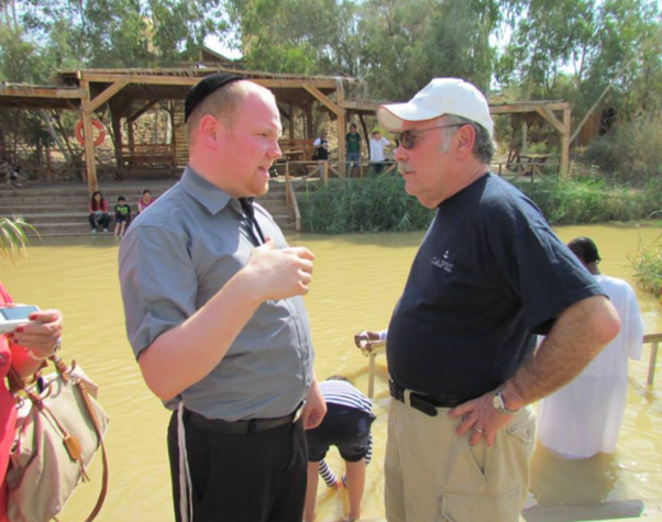 Giving a tour at the exact location of the Jordan River where the stones were retrieved to build the altar on Mount Ebal.