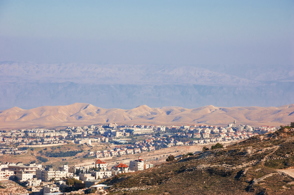 The modern Jewish settlement of Maale Adumim is in the Judean Desert. The high mountains visible in the background are located in Jordan. Photo Credit: Shutterstock