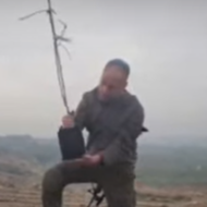 Soldier planting tree in Gaza on Tu Beshvat