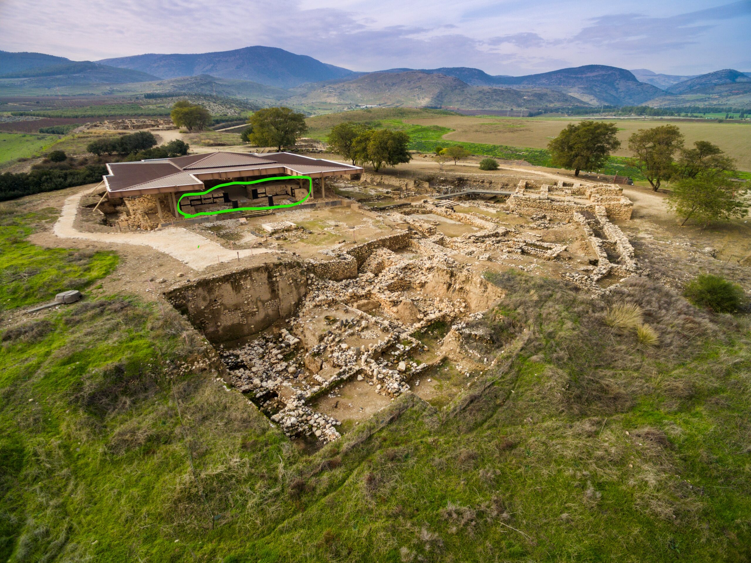 The Canaanite palace with a green circle marking the area on the floor where burn marks from Joshua's time is visible.