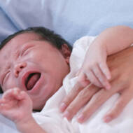 sick newborn crying