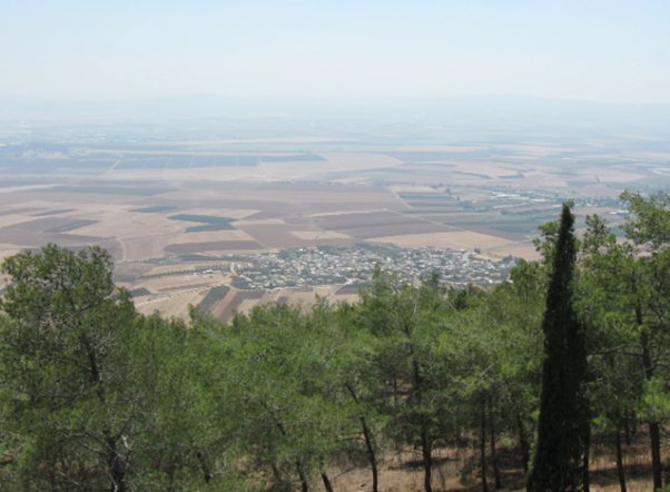 The fields surrounding Sulam, the site of biblical Shunem. In the fields, the woman’s son became ill and subsequently passed away in his mother’s home. Photo Credit: Ori~